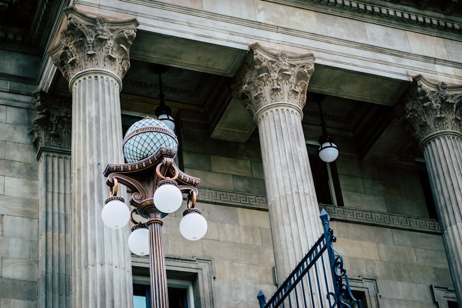 Classic architectural columns with street lamp