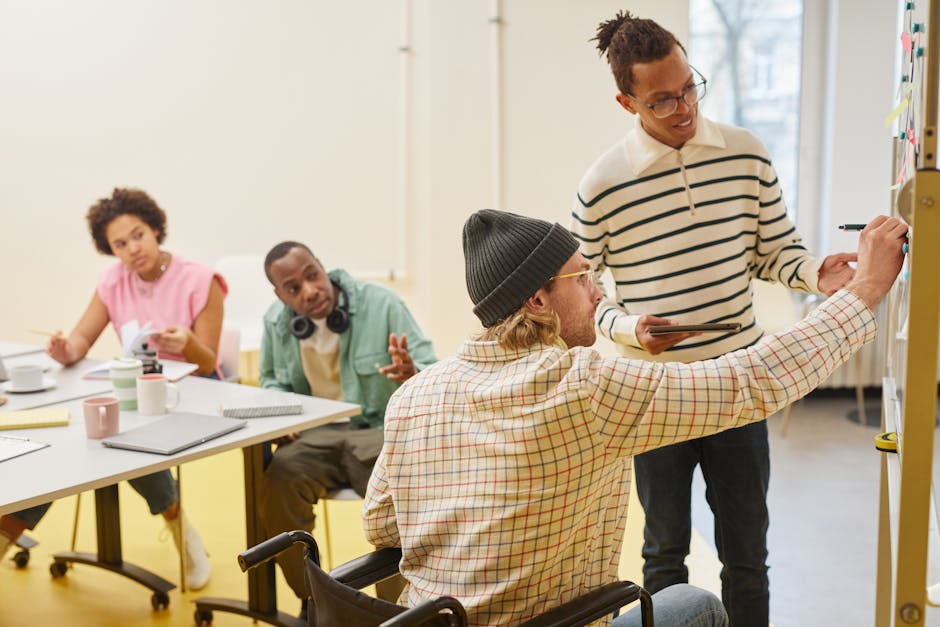 A diverse team collaborating in a modern office setting with a focus on planning and teamwork